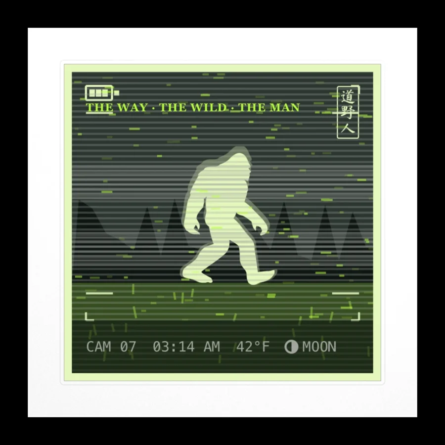 Trail Cam Sticker: a trail camera strapped to a sapling, its lens pointed down a bare gravel road in the dark. He was here. Please do not photograph him.